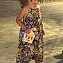 Lina a rejoint le concours — aidez-le/la à gagner de superbes lots ! child, curly_hair, floral_dress, holding, kfc_bucket, light_sticks, yellow_sandals, shadow, night, outdoor, concrete, grass, standing, person, casual, cute, smiling, summer, fun, playful