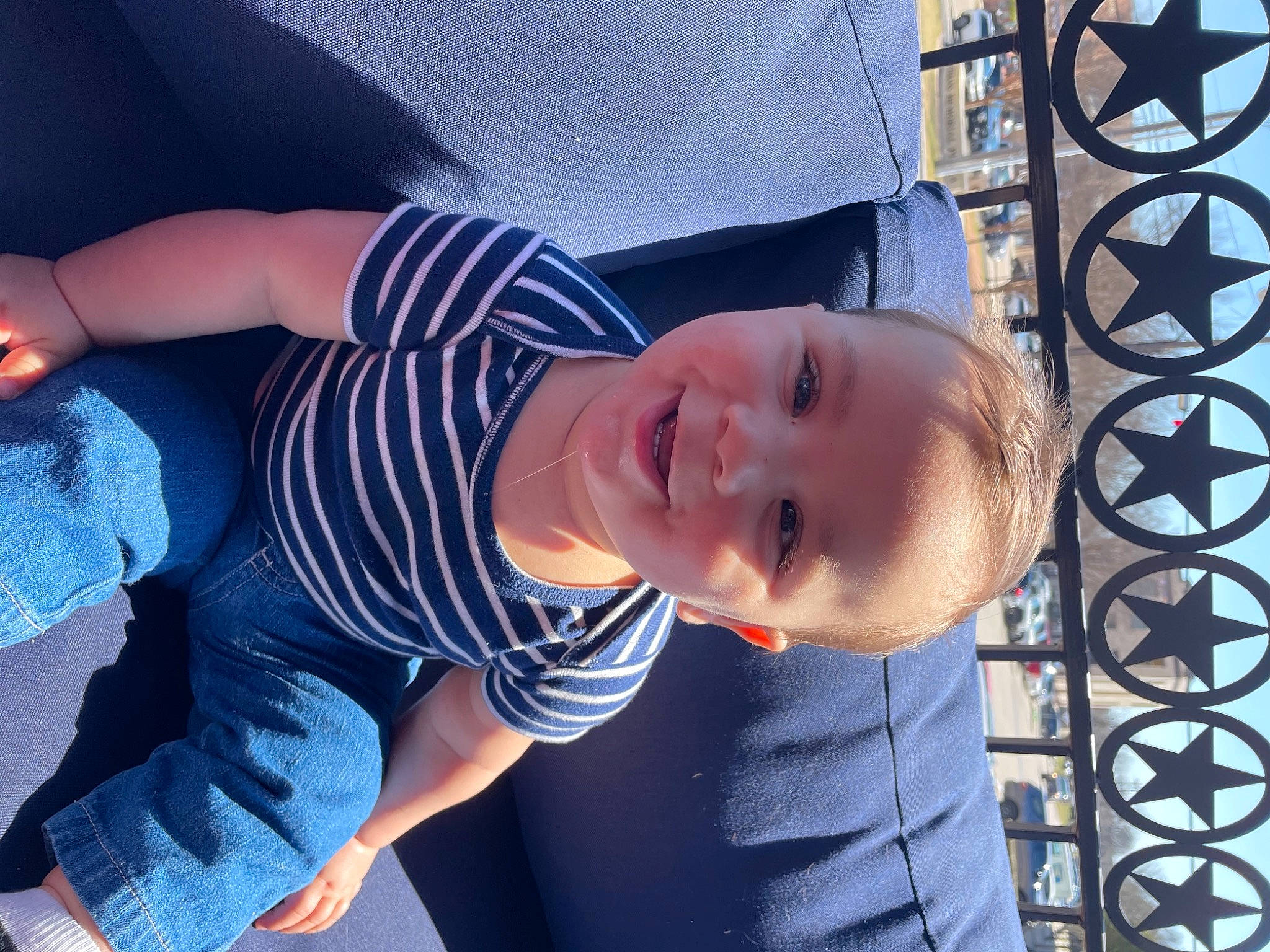 Clay is registered to the contest to win money with this photo: azure, blue, chin, cool, elbow, facial_expression, finger, fun, happy, hat, human_body, joy, mouth, person, skin, smile, standing, textile, thigh, toddler