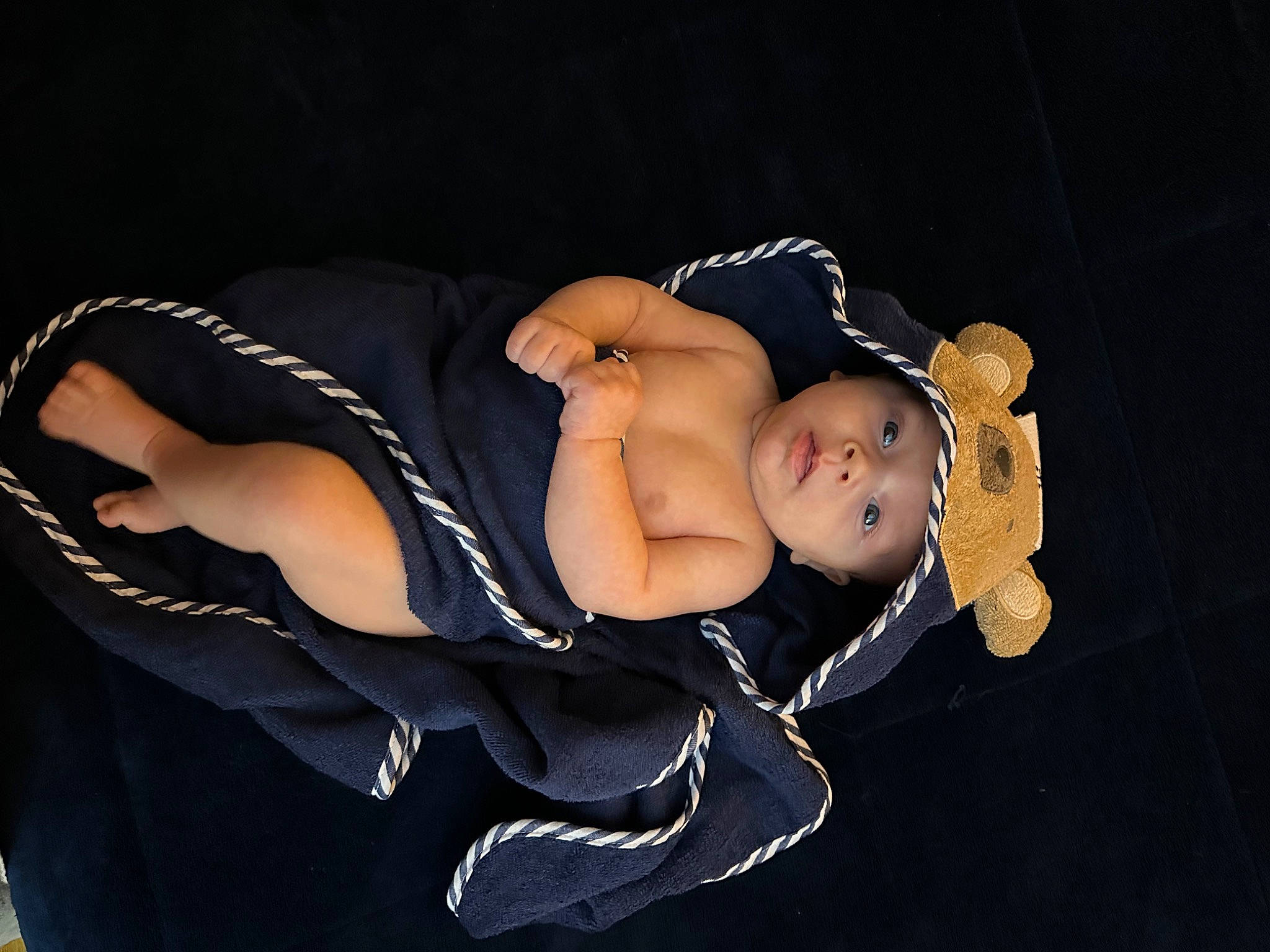 Theodore is registered to the contest to win money with this photo: abdomen, baby, baby_products, baby_toddler_clothing, chest, child, comfort, elbow, fashion_accessory, flash_photography, headwear, human_leg, knee, navel, person, sitting, swimwear, thigh, toddler, trunk