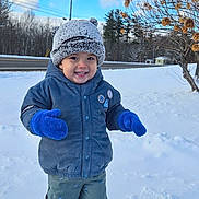 Pedro joined the competition — help win amazing prizes! child, toddler, snow, winter, hat, mittens, blue_mittens, smile, happy, outdoors, jacket, beanie, pants, shoes, footprints, road, trees, sky, shrub, portrait