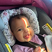 Zinaya joined the competition — help win amazing prizes! baby, child, smiling, car_seat, seatbelt, sunlight, face, hand, clothing, pink, blanket, infant, cute, portrait, indoor, safety, happy, seat, child_safety, car