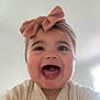 Vivienne is registered to the contest to win money with this photo: baby, child, smiling, headband, bow, face, happy, infant, cute, portrait, apparel, clothing, indoors, skin, person, young, joy, emotion, head, expression
