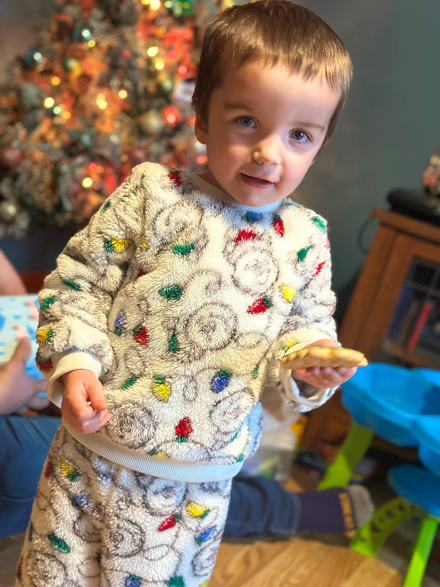 Adam joined the competition — help win amazing prizes! baby, baby_toddler_clothing, child, christmas_tree, event, face, facial_expression, fun, hairstyle, happy, holiday, human, pajamas, pattern, person, sitting, sleeve, smile, standing, t_shirt