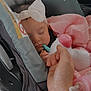 Sakari is registered to the contest to win money with this photo: baby, sleeping, car_seat, headband, blanket, hand, bottle, toy, infant, child, pink, white, holding, peaceful, cute, young, cozy, resting, indoor, car