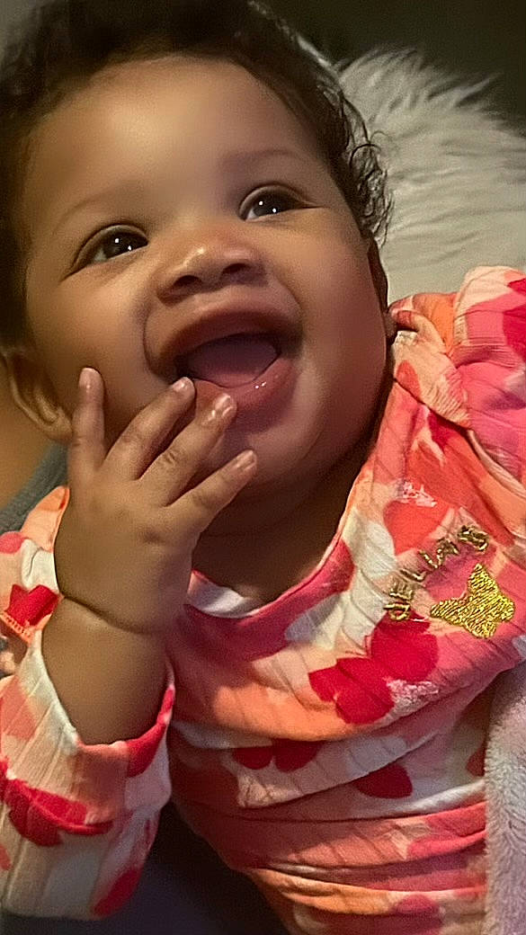 Kanyla joined the competition — help win amazing prizes! cheek, chin, eye, eyebrow, face, finger, gesture, happy, human_body, lip, mouth, nose, people_in_nature, person, pink, skin, sleeve, smile, thumb, toddler