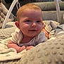 Nevaeh-Rae is registered to the contest to win money with this photo: baby, smiling, blanket, cushion, infant, baby_gym, soft_texture, indoor, cute, child, face, happy, lying_down, cozy, person, head, young_child, comfort, home, relaxed