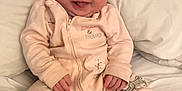 Nevaeh-Rae joined the competition — help win amazing prizes! baby, child, infant, smiling, onesie, bed, pillow, happy, cute, sitting, indoor, person, skin, young, face, tongue, cozy, comfort, clothing, sleepwear