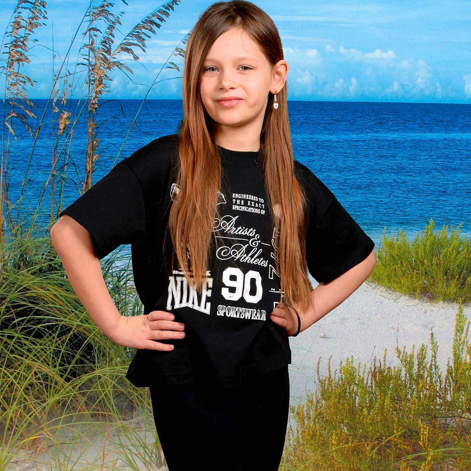 Mia joined the competition — help win amazing prizes! beach, black_tshirt, blue_sky, casual_clothing, child, confidence, earrings, fashion, girl, greenery, long_hair, nature, nike, outdoor, plants, portrait, posing, sand, sea, smile