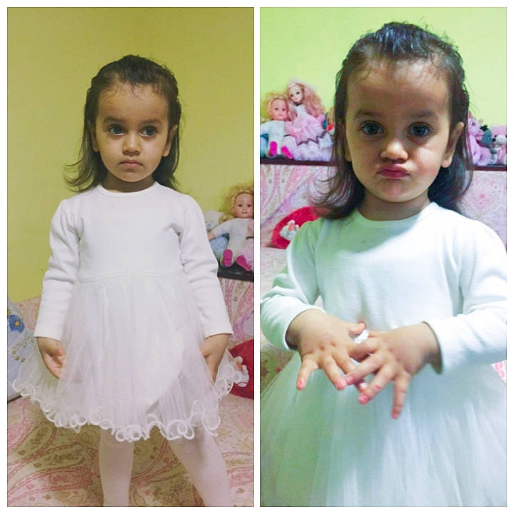 Alexandra is registered to the contest to win money with this photo: arm, baby_toddler_clothing, blurred, day_dress, dress, eyelash, fashion, gesture, hair, hairstyle, happy, head, human_body, neck, outerwear, person, pink, plant, product, purple