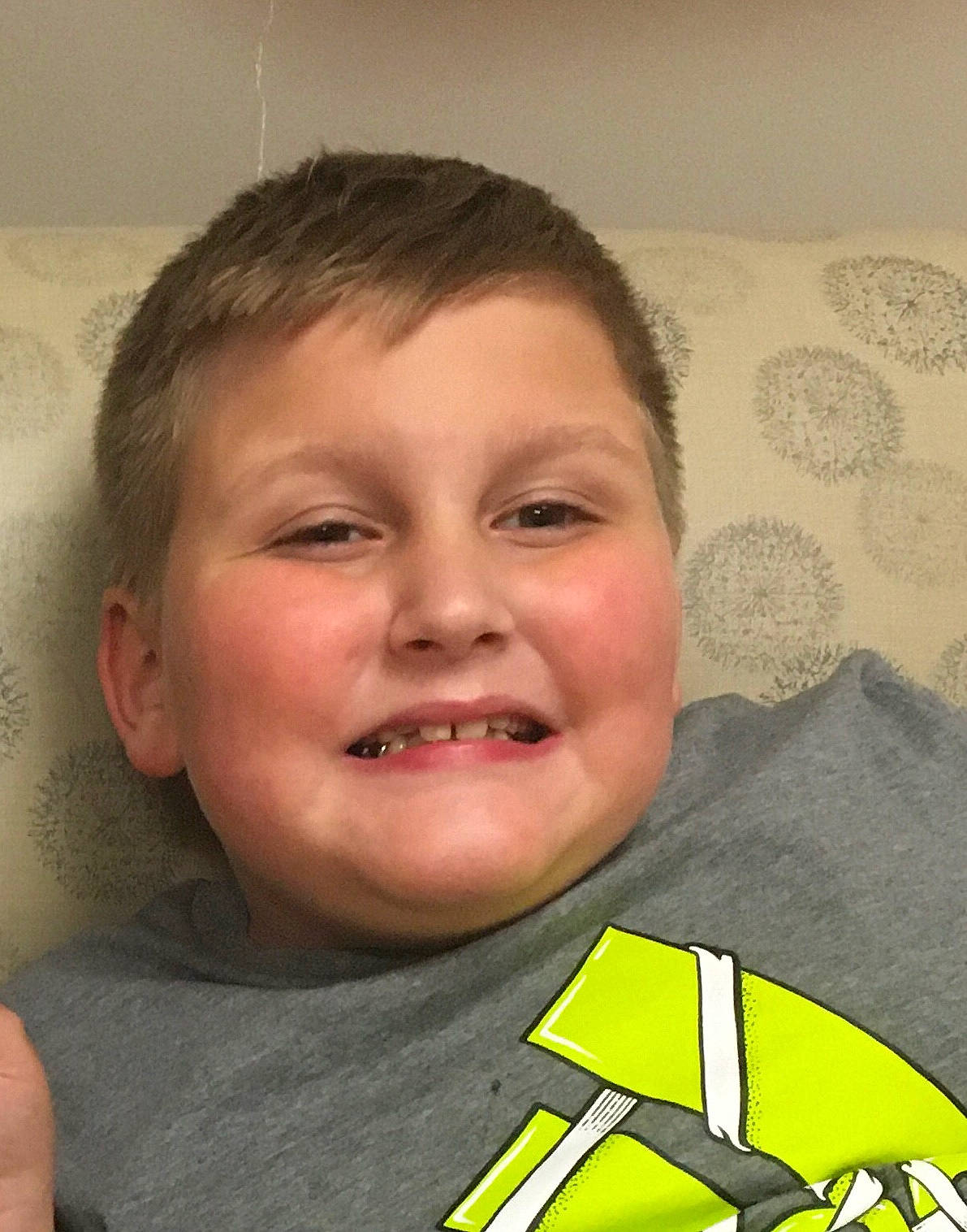 Maddex is registered to the contest to win money with this photo: cheek, child, eyelash, facial_hair, fun, gesture, hair, happy, head, humour, jaw, joy, laugh, nose, person, smile, t_shirt, toddler, tooth, triangle