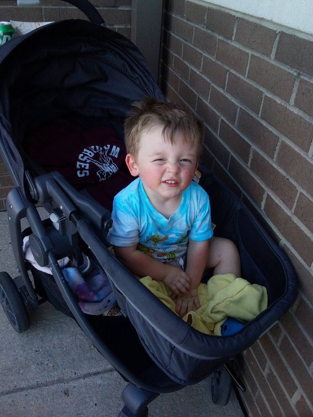 Wyatt is registered to the contest to win money with this photo: auto_part, automotive_tire, baby, baby_carriage, baby_products, baby_toddler_clothing, chair, child, comfort, fender, fun, hairstyle, lap, motor_vehicle, person, product, sitting, smile, tire, toddler