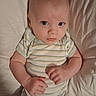 Caleb joined the competition — help win amazing prizes! baby, infant, child, onesie, striped_clothing, bed, pillow, skin, face, eyes, hands, lying_down, looking_up, soft_lighting, indoors, cute, portrait, newborn, human, sleepwear