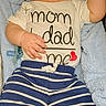 baby, blue_blanket, child, comfortable, cozy, cute, indoors, infant, newborn, pacifier, person, portrait, resting, sleep, sleeping, soft_texture, striped_pants, text_on_clothing, toddler, white_shirt