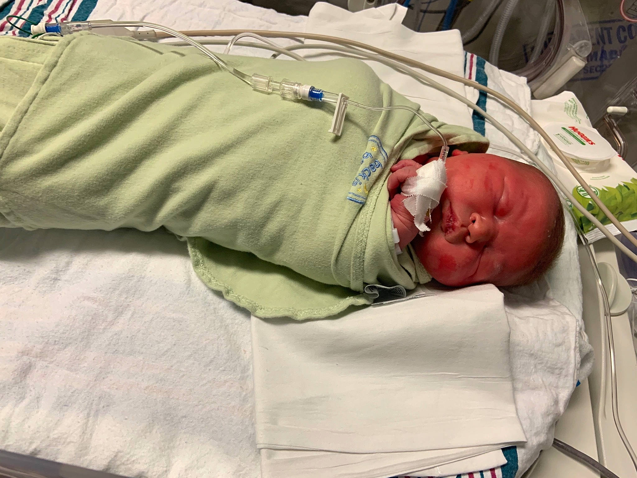 Paislynn is registered to the contest to win money with this photo: baby, baby_products, bed, bedding, child, childbirth, comfort, event, health_care, hospital, hospital_bed, linens, medical, medical_equipment, medical_procedure, nap, patient, person, room, service