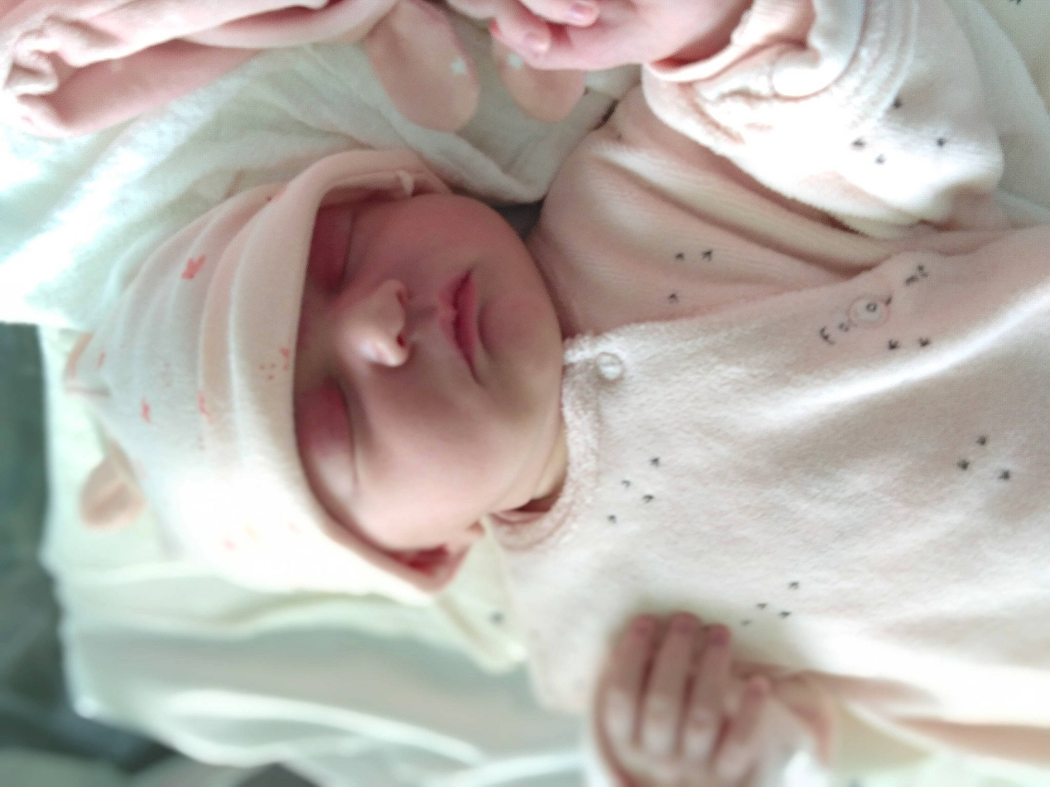 Constance participe au concours pour gagner de l'argent avec cette photo : baby, cheek, child, comfort, eyebrow, face, gesture, happy, headwear, iris, jaw, lip, mouth, nose, person, petal, pink, skin, sleeve, smile