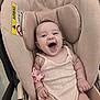Jessica is registered to the contest to win money with this photo: baby, smiling, car_seat, infant, pacifier, pink_outfit, cute, happy, child, seat, clothing, face, skin, head, arm, hand, indoor, seatbelt, accessory, joy