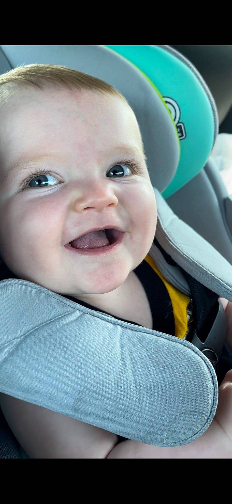 Zane is registered to the contest to win money with this photo: auto_part, baby, baby_in_car_seat, baby_products, baby_toddler_clothing, car_seat, cheek, child, comfort, electric_blue, eyebrow, fashion_accessory, flash_photography, fun, happy, laugh, person, product, skin, smile