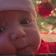 Charlie is registered to the contest to win money with this photo: baby, face, santa_hat, christmas, holiday, close_up, infant, red_clothing, ornament, christmas_tree, festive, holiday_decor, cheeks, cute, child, peeking, celebration, seasonal, holiday_spirit, indoors