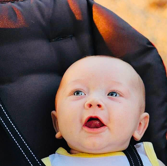 George joined the competition — help win amazing prizes! baby, baby_carriage, black, cheek, comfort, ear, eye, eyebrow, face, happy, head, iris, mouth, nose, person, photograph, skin, smile, toddler, white