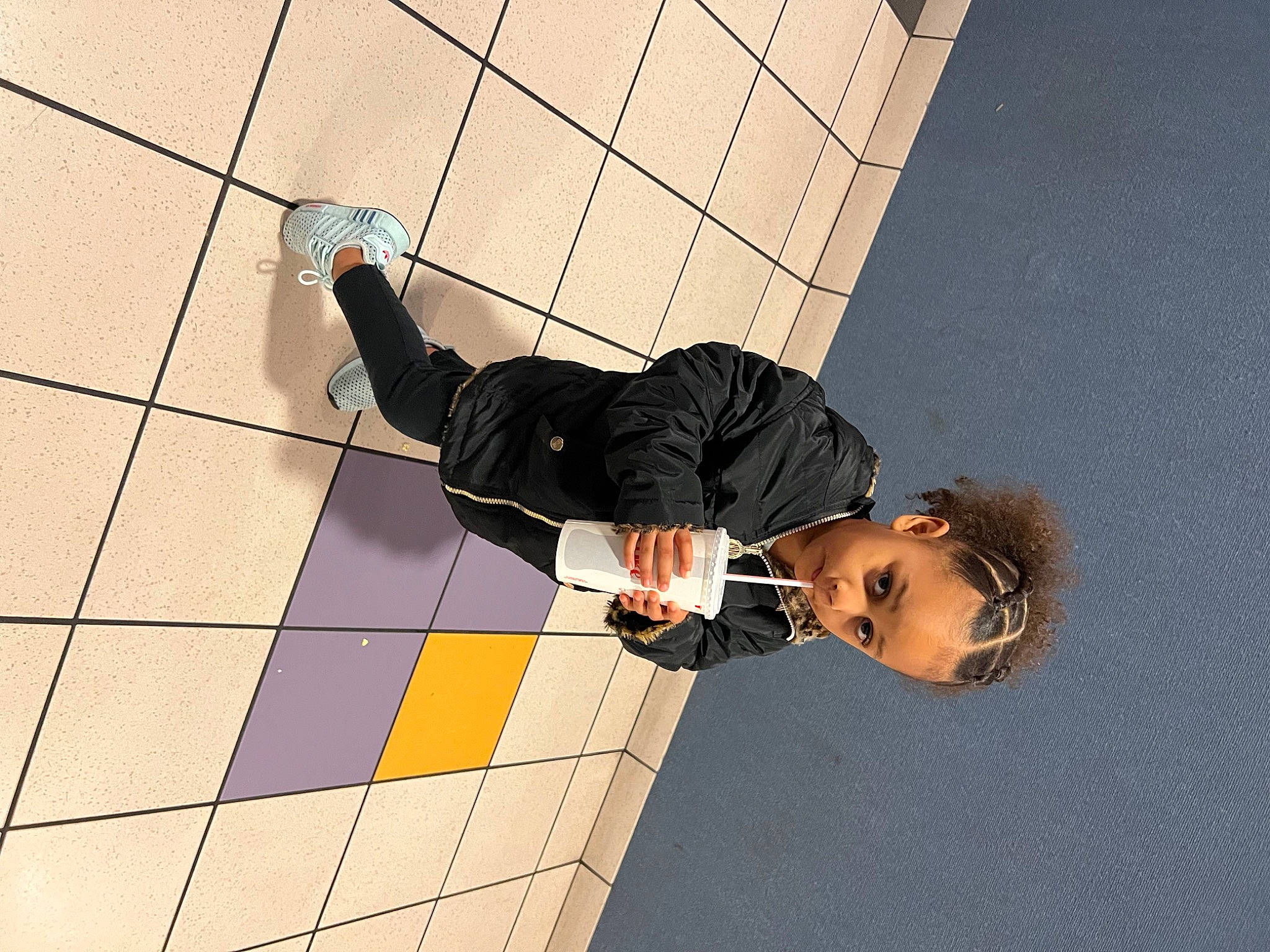 Leilani is registered to the contest to win money with this photo: dress_shirt, elbow, eyewear, flooring, font, fun, gesture, human_leg, knee, pattern, person, recreation, shadow, sitting, sleeve, thigh, thumb, wrist