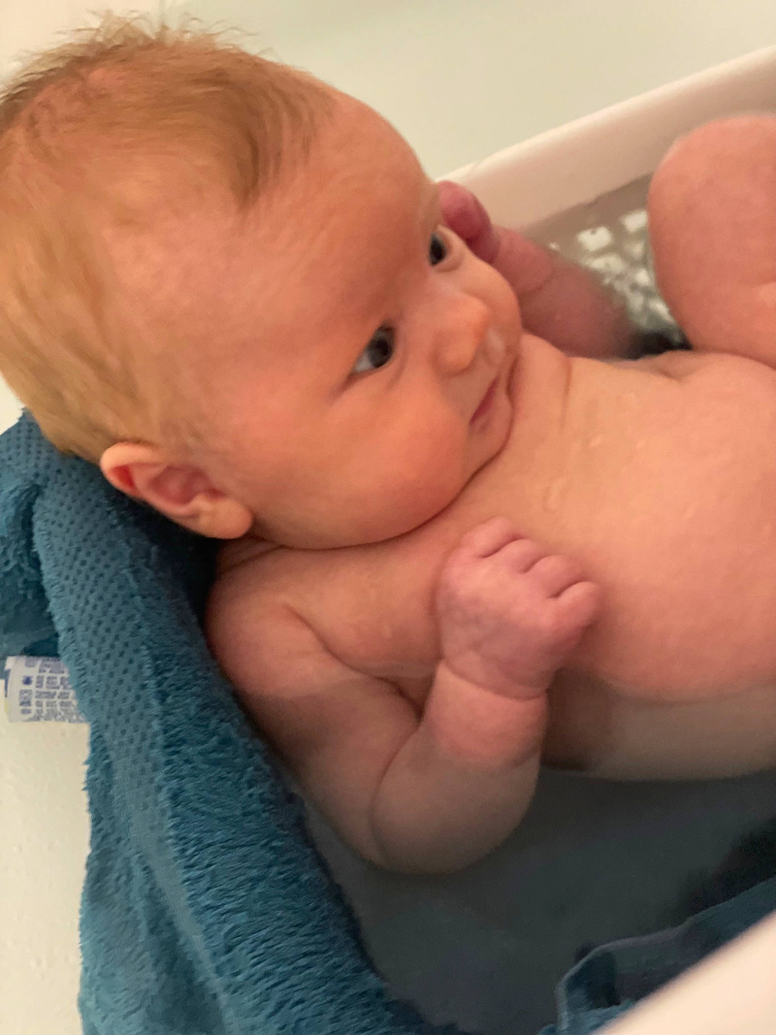 Christine is registered to the contest to win money with this photo: arm, baby, cheek, comfort, eyebrow, eyelash, finger, gesture, hand, head, human_body, iris, lip, mouth, neck, nose, person, skin, sleeve, stomach