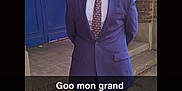 Jean a rejoint le concours — aidez-le/la à gagner de superbes lots ! accessories, adult, blazer, clothing, coat, face, footwear, formalwear, glasses, jacket, male, man, necktie, pants, person, shoe, sneaker, standing, suit, tie