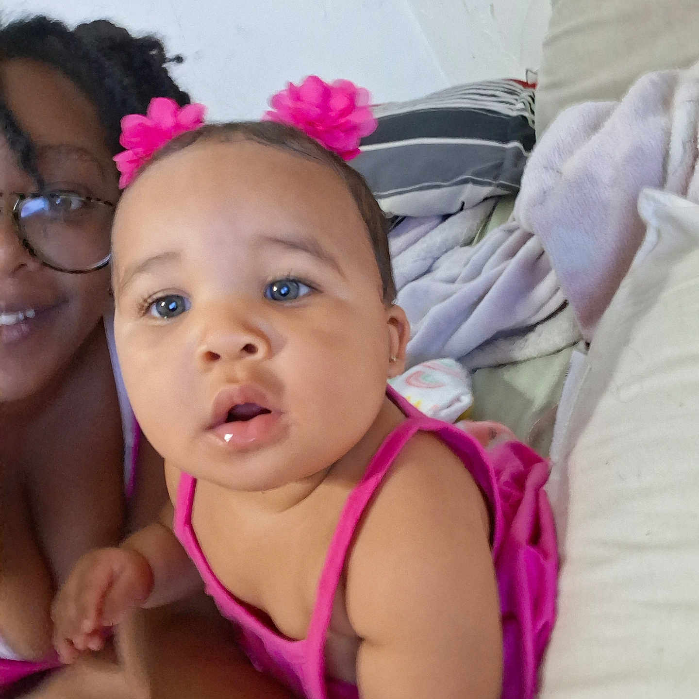 Kea'Loni joined the competition — help win amazing prizes! baby, blanket, casual, child, closeup, couch, curious, expression, face, flower, glasses, hair_accessories, home, indoor, person, pillow, pink_dress, portrait, skin, woman