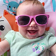 Alayia joined the competition — help win amazing prizes! animal_print, baby, child, clothing, colorful, cute, face, fashion, funny_hair, happy, indoor, infant, joyful, mohawk, playful, portrait, seat, smile, sunglasses, toddler