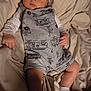 baby, bed, bedroom, blanket, clothing, couch, cushion, face, furniture, head, homedecor, hosiery, indoors, newborn, pants, person, photography, portrait, room, sock