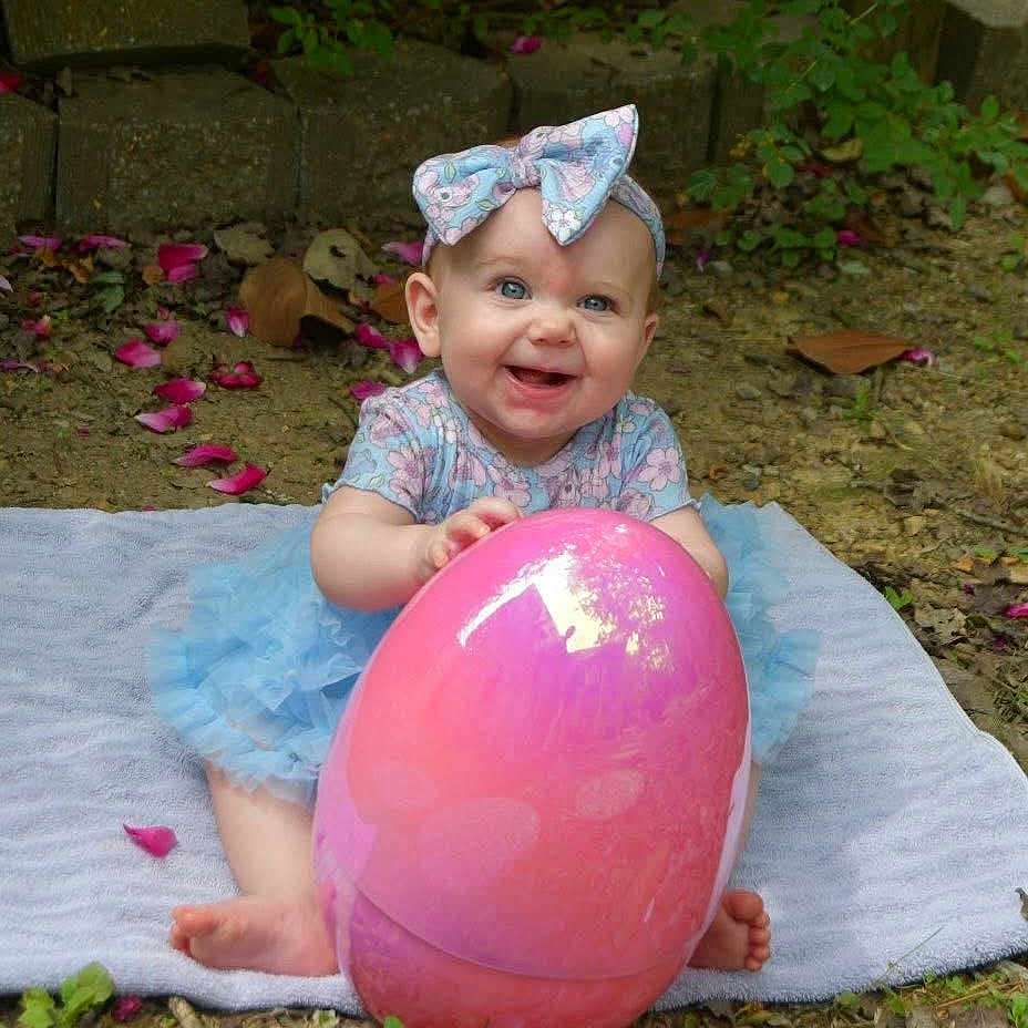 Allision joined the competition — help win amazing prizes! baby, backyard, balloon, clothing, dress, face, flower, grass, head, nature, outdoors, person, petal, photography, plant, portrait, pottedplant, purple, soil, yard