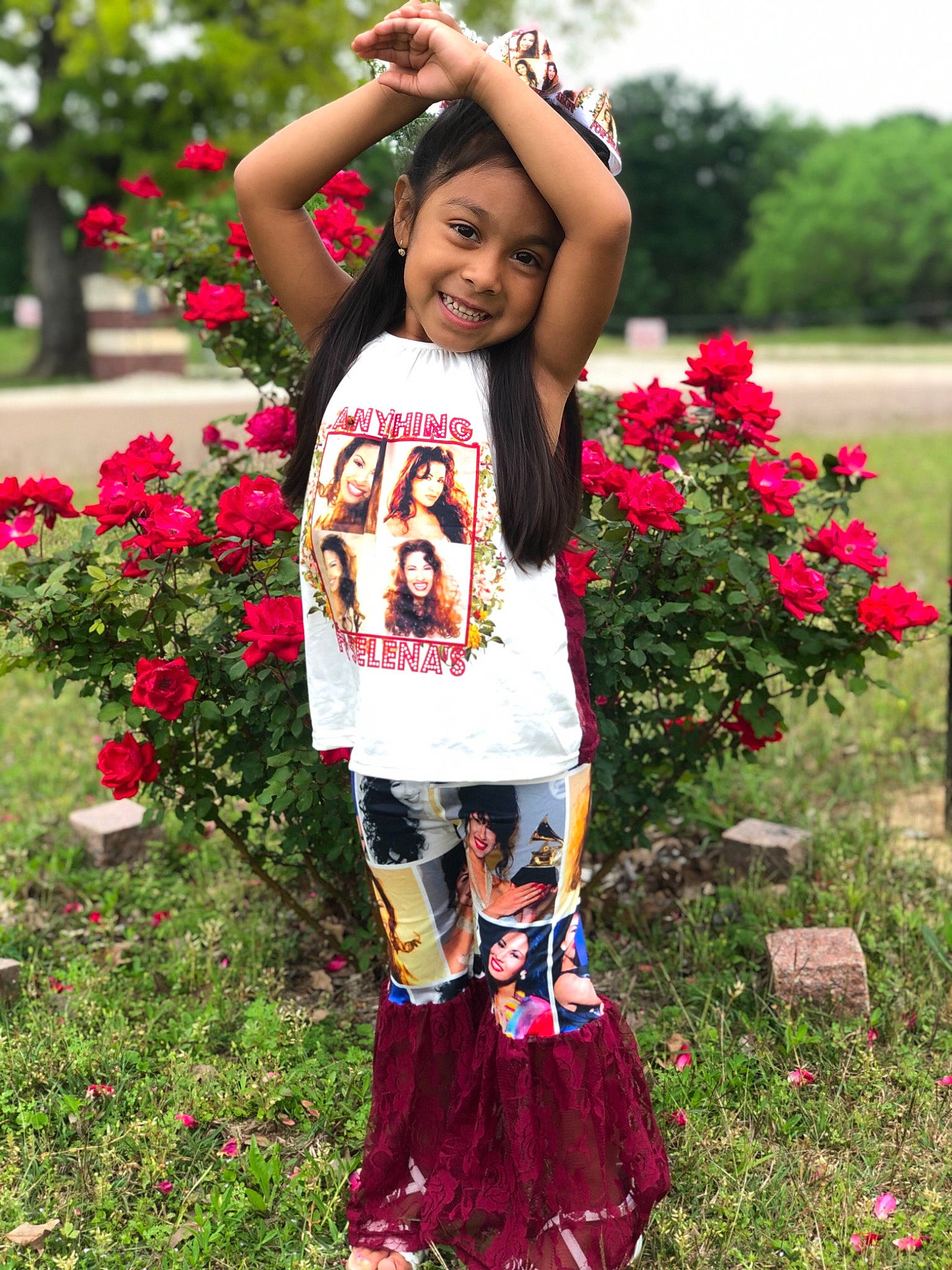 Cecelia is registered to the contest to win money with this photo: botany, clothing, flower, grass, happy, joy, magenta, people_in_nature, person, photograph, pink, plant, red, shoulder, sleeve, smile, street_fashion, summer, t_shirt, toddler