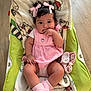 baby, child, pink_dress, pink_bows, baby_seat, blanket, indoor, floor, socks, cute, infant, portrait, person, baby_girl, hand_in_mouth, curious, seated, cozy, plush_blanket, wooden_floor