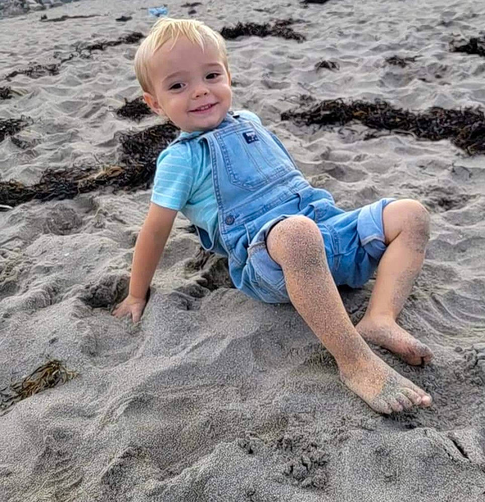 Karsen joined the competition — help win amazing prizes! baby_toddler_clothing, barefoot, beach, body_of_water, child, denim, electric_blue, foot, fun, happy, human_body, human_leg, joy, leg, people_in_nature, people_on_beach, person, sand, smile, t_shirt