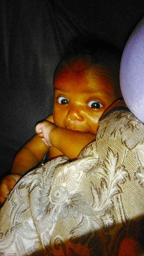 Kaiden is registered to the contest to win money with this photo: art, chest, child, doll, fashion_accessory, figurine, fur, headgear, linens, peach, person, room, sitting, toy, wig, wood