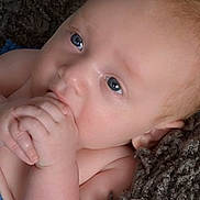 Asher is registered to the contest to win money with this photo: baby, infant, child, face, hand, skin, blue_eyes, close_up, blanket, texture, cute, peaceful, lying_down, natural_light, portrait, human, newborn, soft, innocence, curious