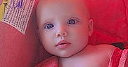 Cali joined the competition — help win amazing prizes! baby, child, infant, car_seat, red, towel, straps, face, skin, eyes, head, seat, indoor, closeup, portrait, young, child_seat, safety, candid, baby_boy