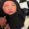 baby, black_hoodie, blanket, checkered_pattern, child, clothing, cozy, cute, face, hand, hood, indoors, infant, newborn, portrait, resting, sleepy, soft_texture, toddler, young