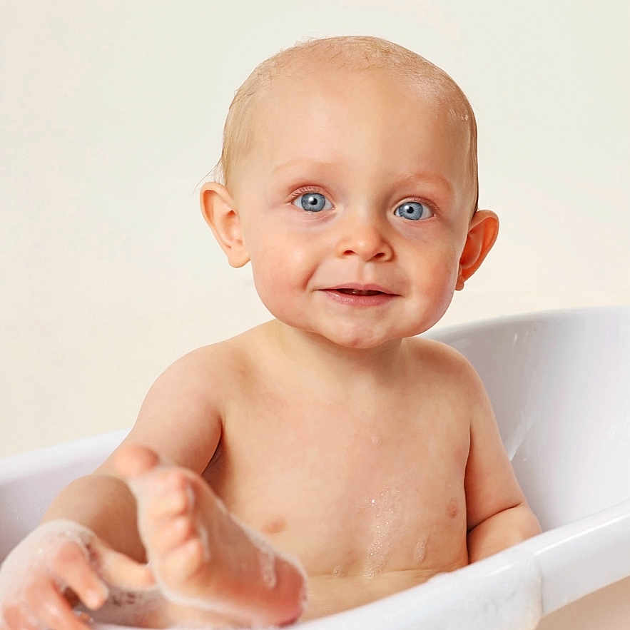 Tommy is registered to the contest to win money with this photo: baby, bath, bathtub, bubbles, child, cute, face, foot, happy, infant, naked, person, playful, portrait, skin, smile, soap, toddler, water, wet