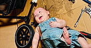 Albert joined the competition — help win amazing prizes! baby, cardboard, carpet, denim_overalls, drill, floor, foot, hand, happy, infant, person, pliers, repair, smile, socket, stroller, tool, wheel, workshop, wrench