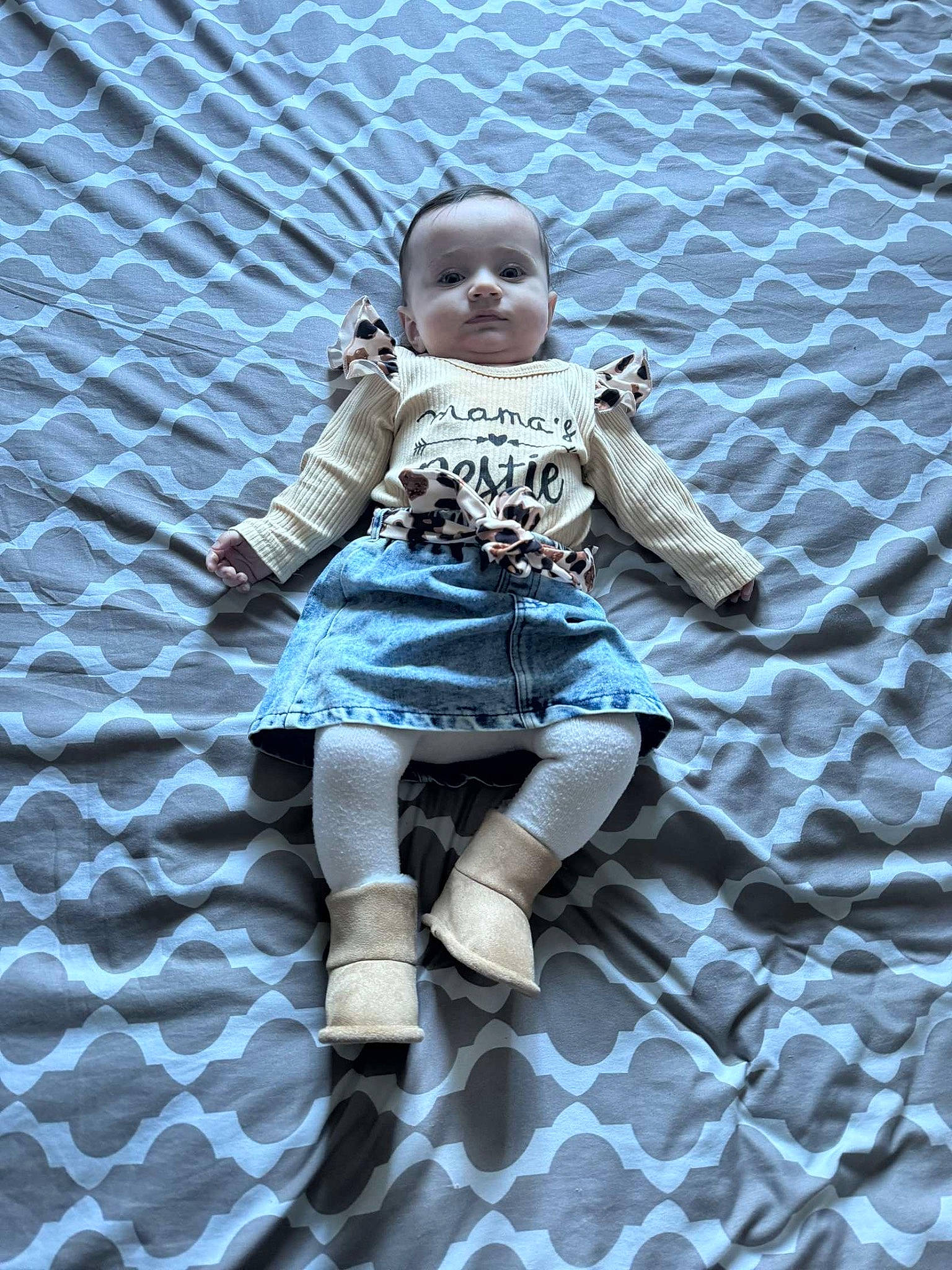 Maïwenn participe au concours pour gagner de l'argent avec cette photo : baby, baby_toddler_clothing, boot, child, doll, dress, electric_blue, fun, grass, human_leg, pattern, person, sandal, shadow, sitting, sleeve, sock, thigh, toddler, toy