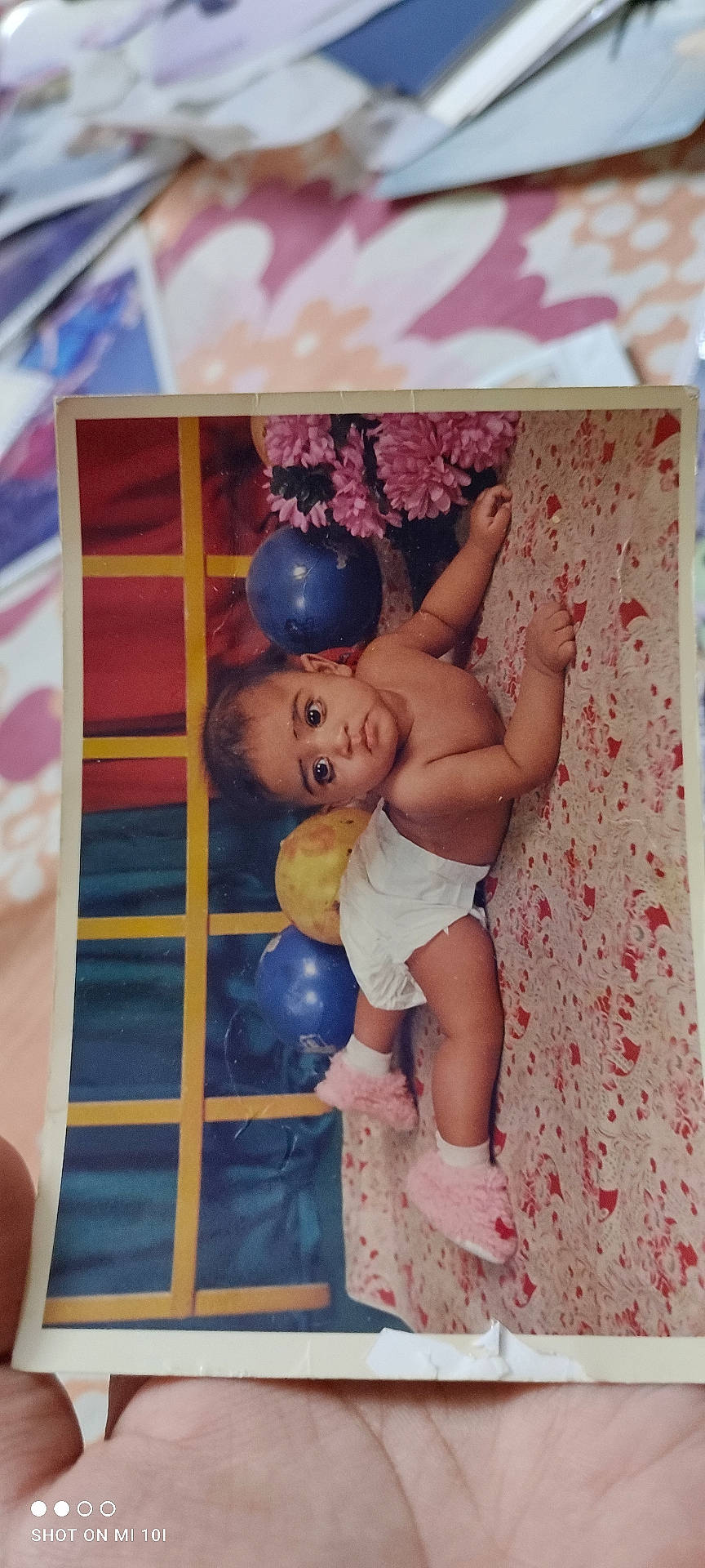 Ammaar is registered to the contest to win money with this photo: baby, balloon, bodypart, clothing, diaper, face, finger, footwear, hand, head, newborn, people, person, photography, portrait, purple, quilt, shoe, shorts, sphere