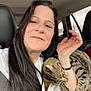 Baby Booge is registered to the contest to win money with this photo: woman, cat, tabby_cat, car_interior, seatbelt, long_hair, white_shirt, window, foggy_window, hand, pet, snuggling, closeup, portrait, indoor, seat, animal, feline, human, casual