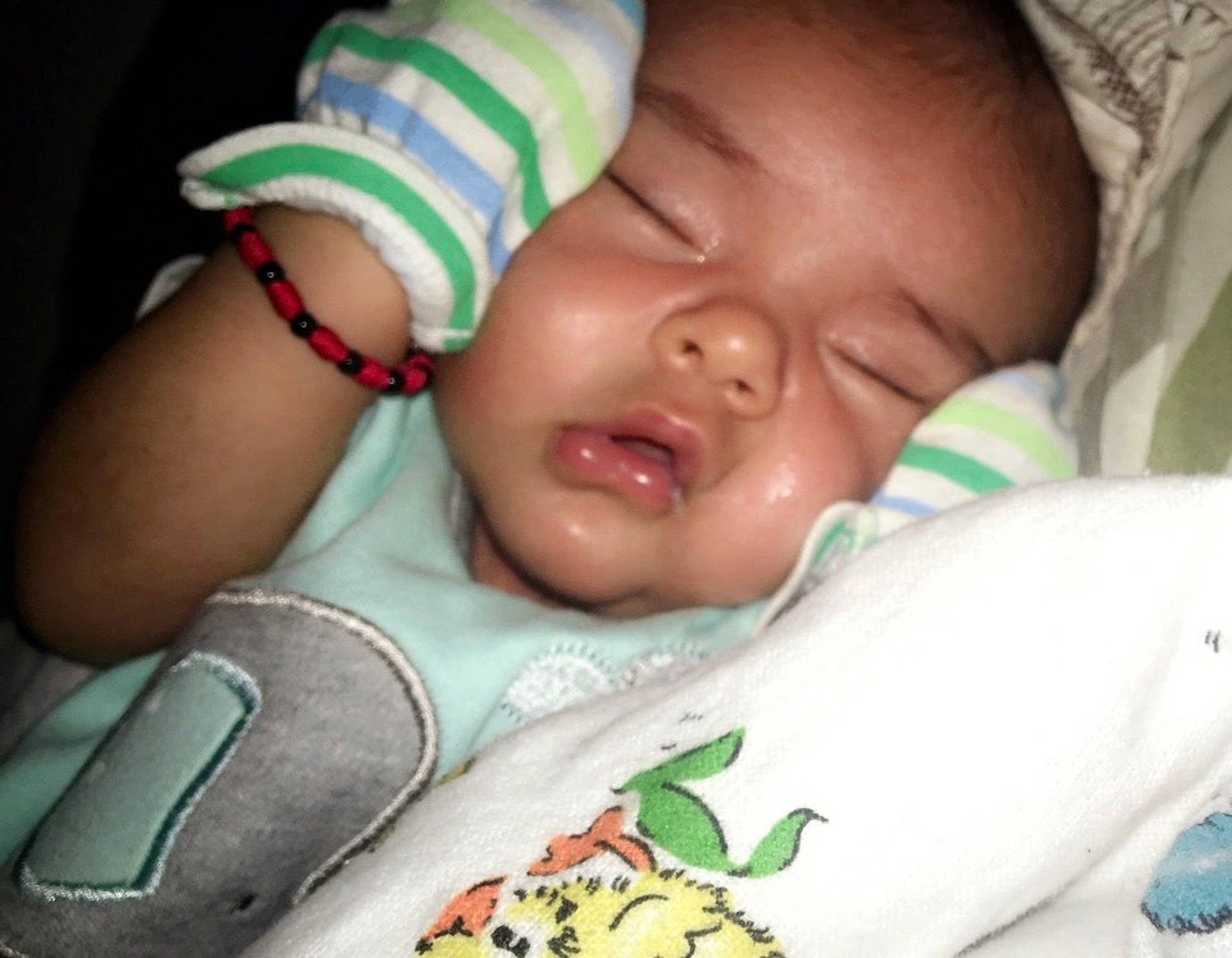 Isaiah is registered to the contest to win money with this photo: arm, baby_products, bedtime, cheek, child, ear, face, finger, infant, lip, mouth, nap, nose, person, product, skin, sleep, smile, toddler