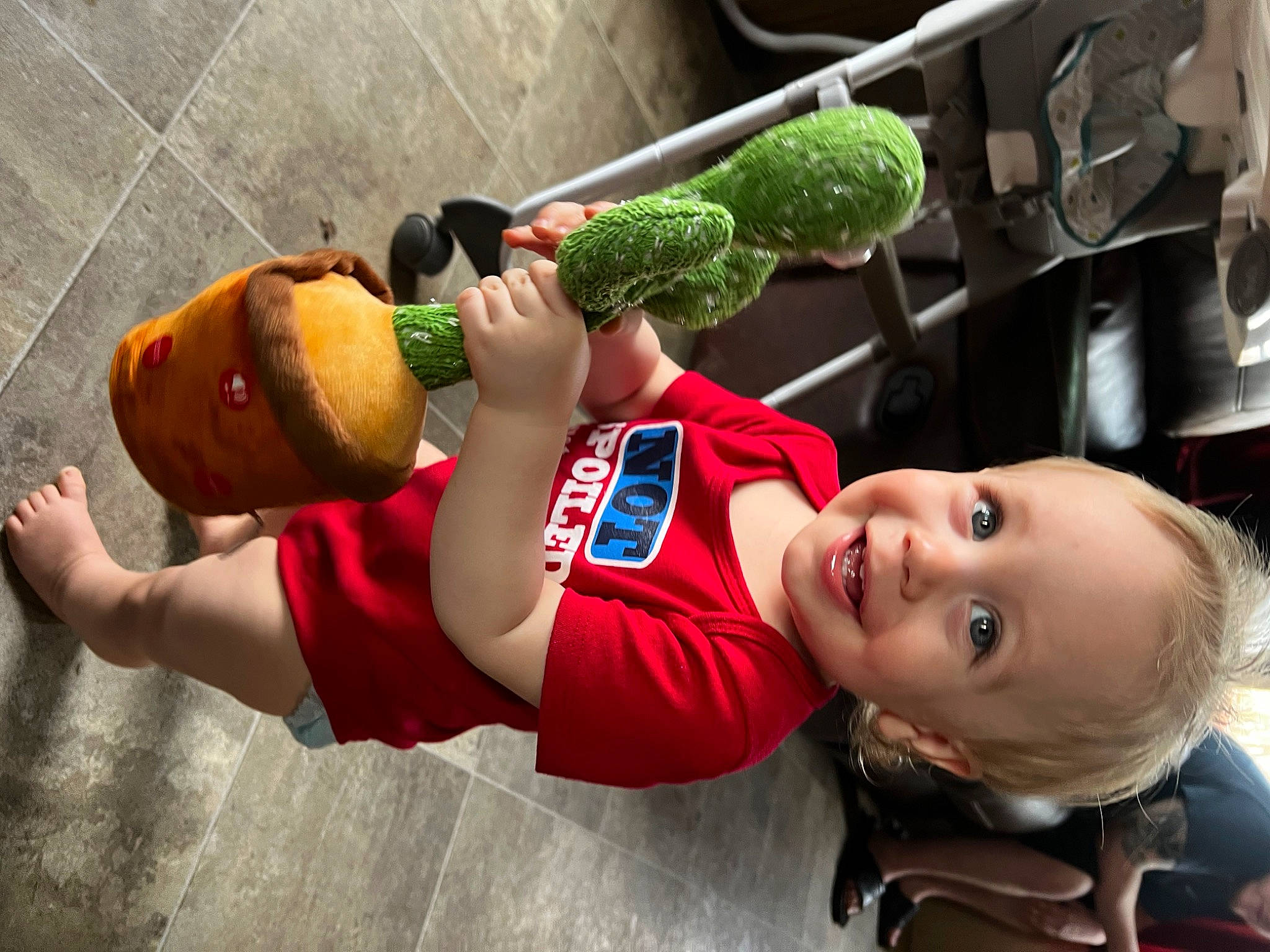 Chandler is registered to the contest to win money with this photo: child, fun, happy, joy, leisure, person, plant, play, plush, recreation, smile, stuffed_toy, t_shirt, thigh, toddler, toy, vacation