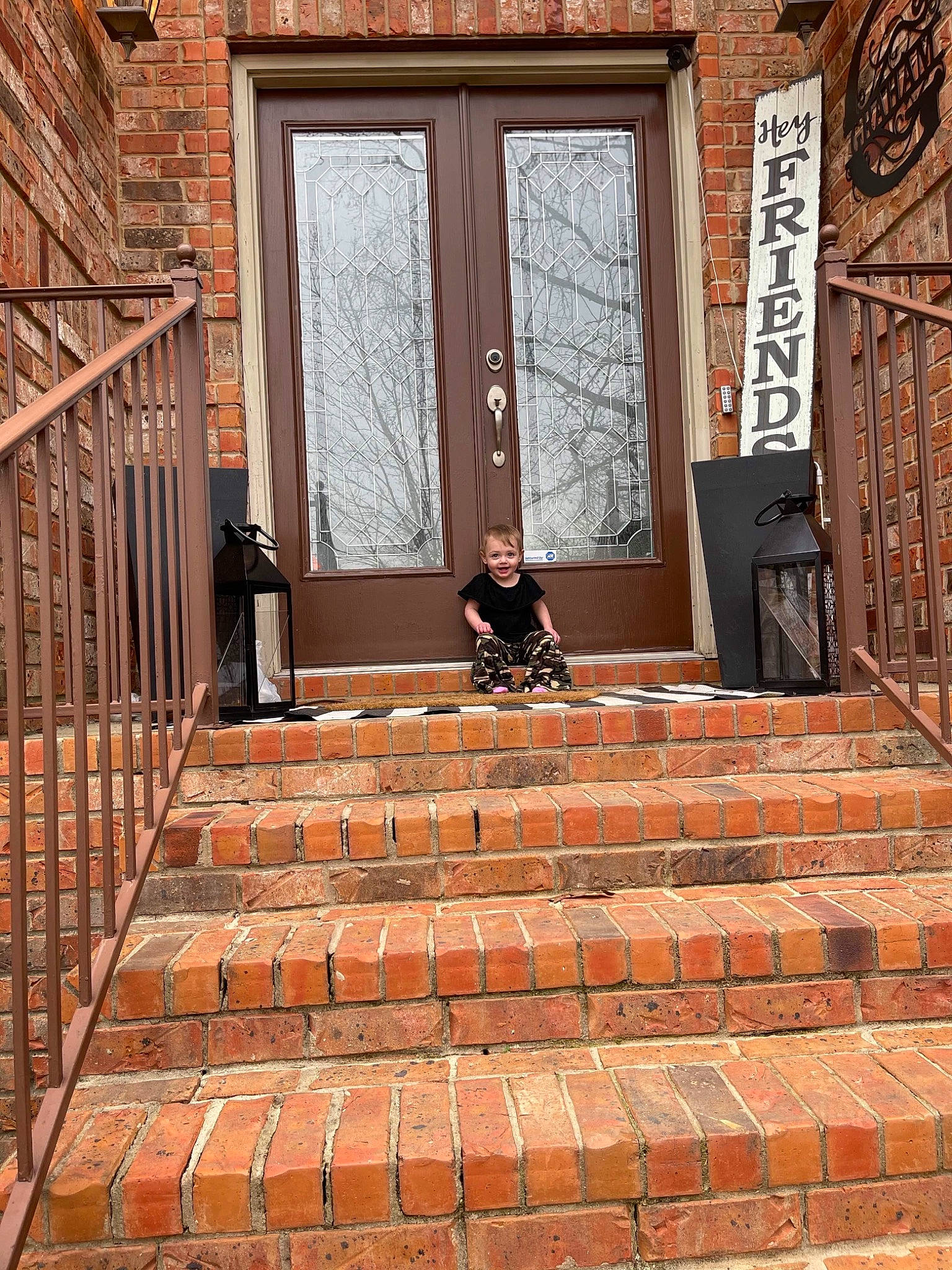 Maddison is registered to the contest to win money with this photo: alley, brick, brickwork, building, cobblestone, door, facade, flooring, house, joy, orange, person, property, road_surface, shadow, sidewalk, stairs, standing, street, symmetry