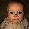 Jennsyn is registered to the contest to win money with this photo: baby, infant, face, polka_dot, clothing, skin, head, eyes, nose, mouth, green_heart, sticker, expression, portrait, close_up, child, cute, indoors, person, newborn
