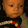 Jennsyn joined the competition — help win amazing prizes! baby, infant, car_seat, pacifier, beads, clothing, face, child, closeup, expression, human, seatbelt, toy, young_child, indoors, portrait, skin, head, hand, looking_away
