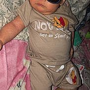 Jennsyn joined the competition — help win amazing prizes! baby, child, sunglasses, wearing_clothes, winnie_the_pooh, beige_outfit, blanket, pillow, floral_pattern, pink_blanket, indoor, cute, portrait, laying_down, sleepy, infant, person, cool, flash_photography, relaxing