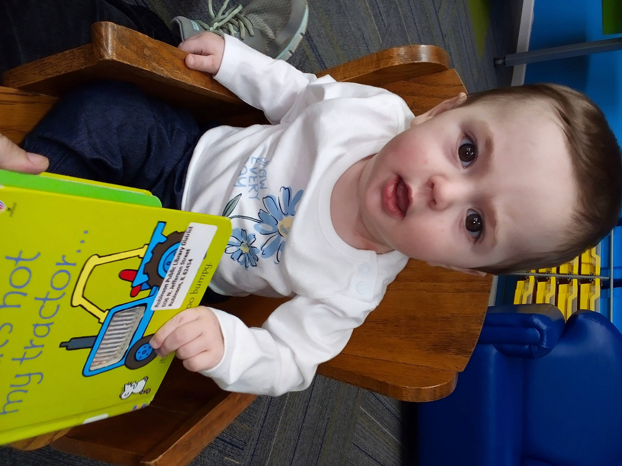 Pasiley joined the competition — help win amazing prizes! baby, baby_products, baby_toddler_clothing, blue, book, chair, child, fun, person, play, publication, reading, room, sitting, surprise, toddler, visual_arts, wood