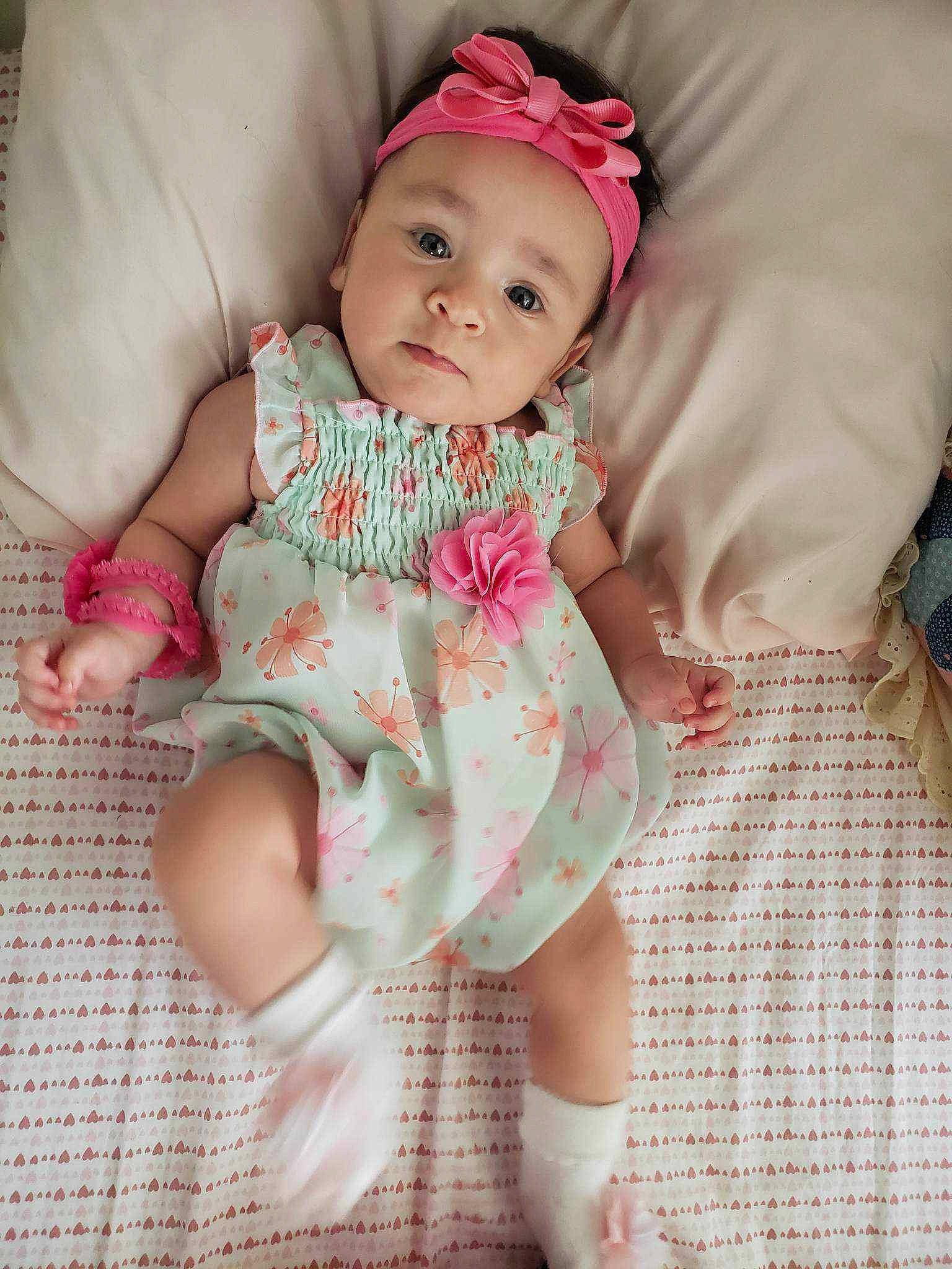 Toni joined the competition — help win amazing prizes! baby, baby_toddler_clothing, cheek, child, comfort, dress, face, facial_expression, happy, headwear, human_leg, leg, magenta, pattern, person, pink, skin, sleeve, smile, sock